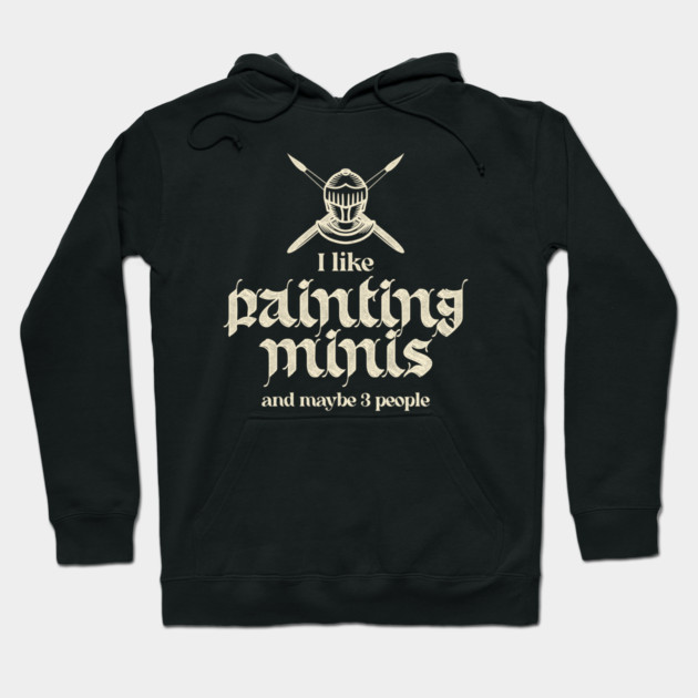 Black hoodie with "I like painting minis" text, medieval style, casual wear, cotton blend, ideal for hobbyists.