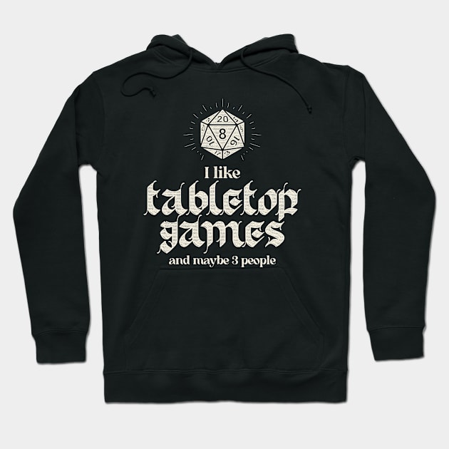 Black hoodie with "I Like Tabletop Games" text and dice graphic, ideal for gaming enthusiasts, cotton material.