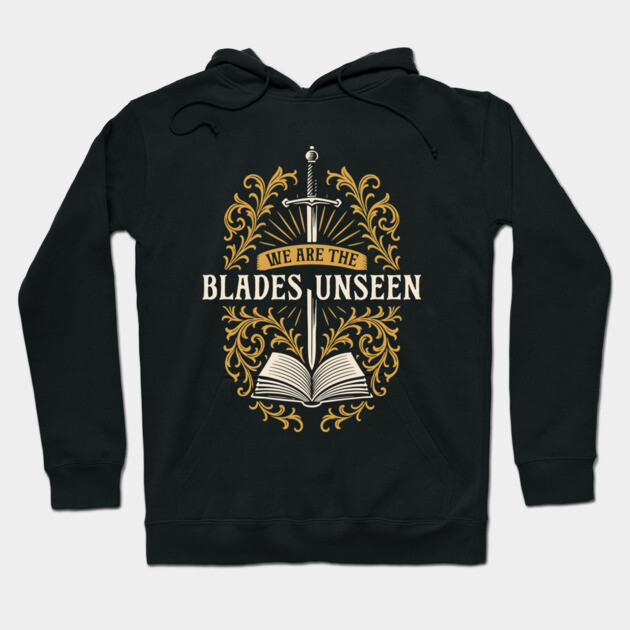 Black hoodie with "We Are The Blades Unseen" design featuring a sword, book, and ornate gold detailing.