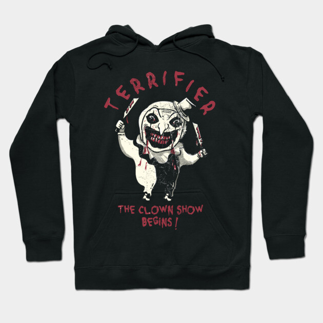 Black Terrifier hoodie featuring a clown graphic and text, ideal for horror fans, made from soft cotton blend.