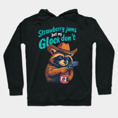 Black hoodie with a playful raccoon graphic, text saying "Strawberry jams but my Glock don't," casual wear.