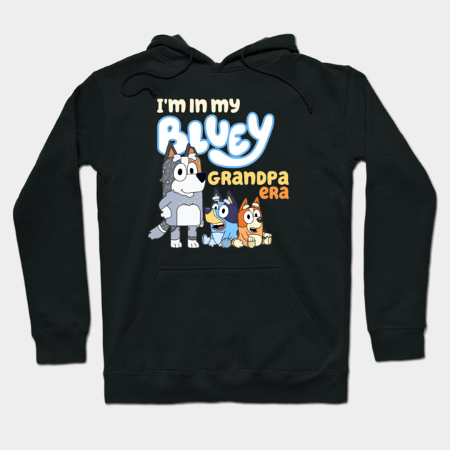 Black hoodie with playful cartoon design, text "I'm in my Bluey Grandpa Era," cozy and stylish for casual wear.