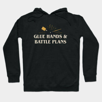 Black hoodie with "Glue Hands & Battle Plans" text, creative design, casual wear, cotton blend, front pocket.
