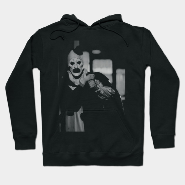"Black hoodie featuring a vintage clown graphic, cozy cotton material, perfect for casual wear or Halloween occasions."