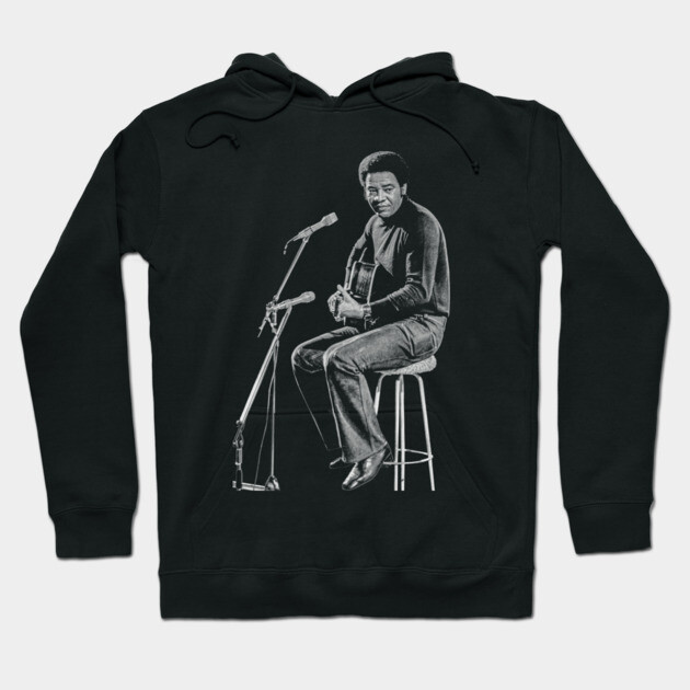 Black hoodie featuring a musician graphic print, made of cotton, perfect for casual wear and music lovers.