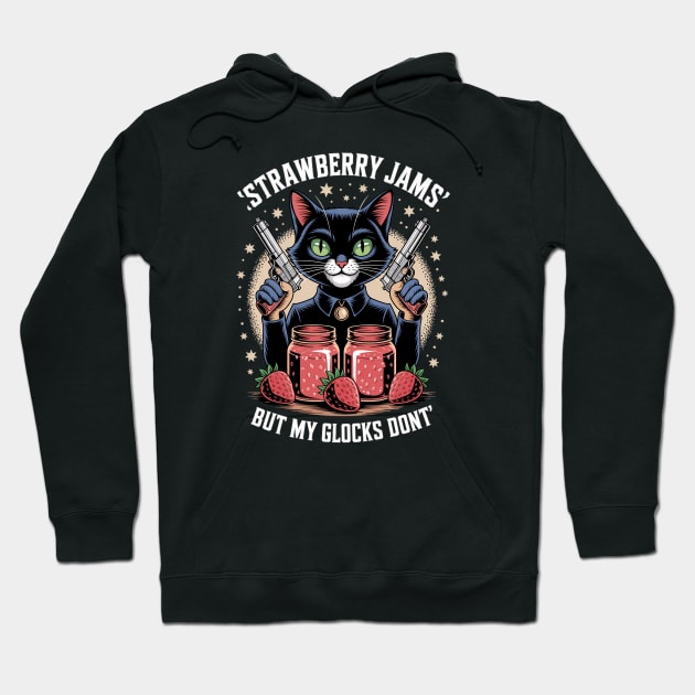 Black hoodie with cat and strawberry jar graphic, text reads "Strawberry Jams But My Glocks Don't," casual wear.