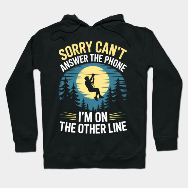 Black hoodie with "Sorry Can't Answer the Phone, I'm on the Other Line" text, featuring a nature-themed graphic design.