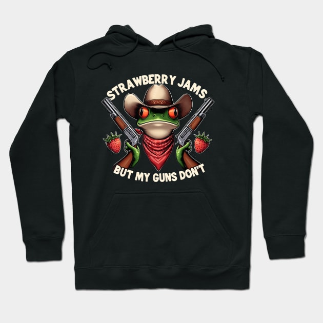 Black hoodie with playful frog design, cowboy hat, strawberries, and text "Strawberry Jams But My Guns Don't."