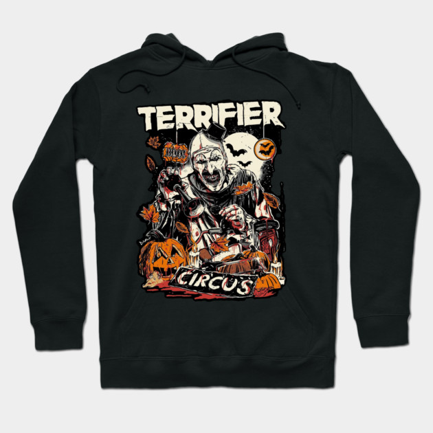 Black Halloween-themed hoodie with "Terrifier Circus" graphic, featuring pumpkins and spooky designs. Perfect for fall wear.