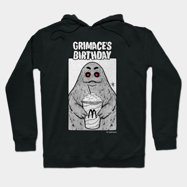 Black hoodie with Grimace's Birthday graphic, featuring a cute character holding a drink, casual wear.