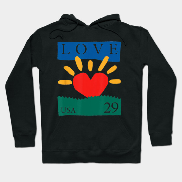 Black hoodie with colorful "Love" design, featuring red heart and yellow sunburst, cotton material, casual wear.