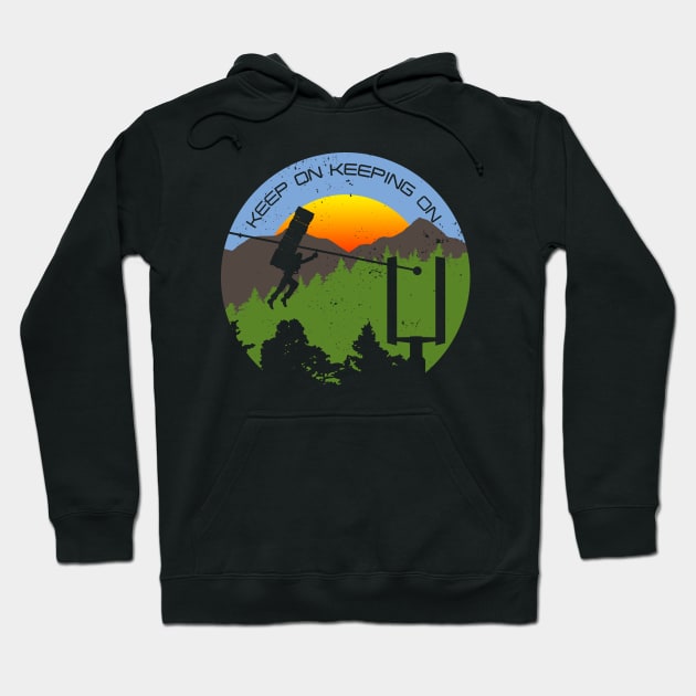 Black hoodie with colorful mountain and sunset graphic, featuring "Keep On Keeping On" text, casual cotton style.
