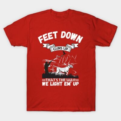 Red hunting-themed graphic t-shirt, "Feet Down Guns Up" design, casual style, comfortable cotton material.