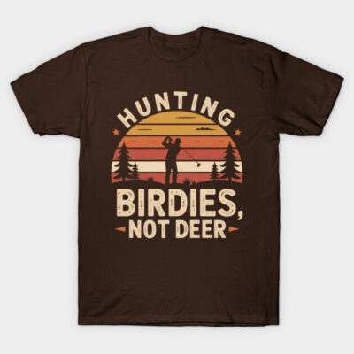 Brown graphic tee with "Hunting Birdies, Not Deer" slogan, featuring sunset and golfer silhouette. Casual cotton shirt.